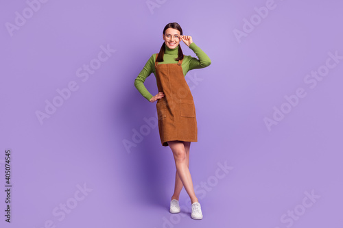 Full length body size view of pretty cheerful girl teacher lecturer posing touching specs isolated over violet pastel color background