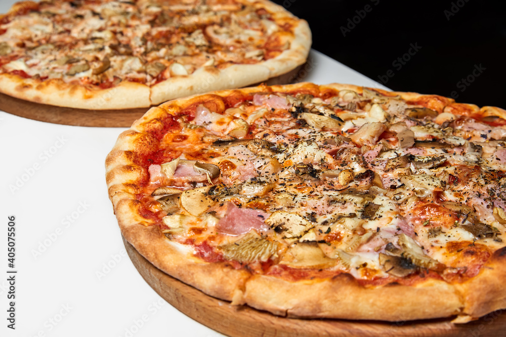 Fresh pizza with bacon, mushrooms and cheese on a light background. Close-up, selective focus