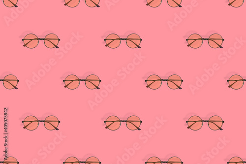 Glasses seamless pattern. Glasses for improving vision on a red background.