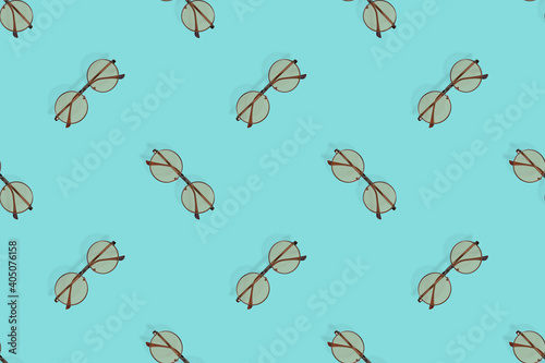 Glasses seamless pattern. Glasses for improving vision on an aquamarine background.