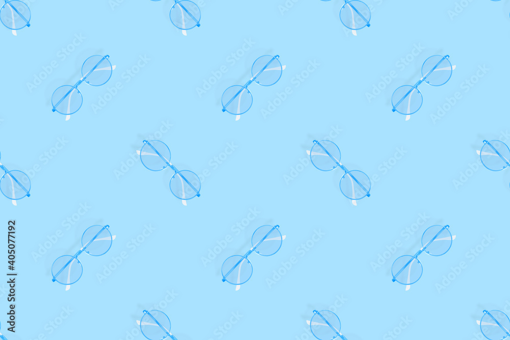 Glasses seamless pattern. Glasses for improving vision on a blue background.