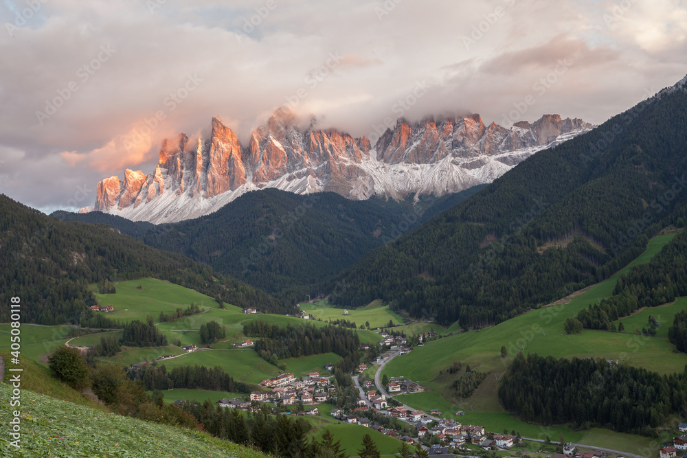 Small Italian mountain town of St. Magdalena in Val di Funes at sunset Small Italian mountain town of St. Magdalena in Val di Funes at sunset