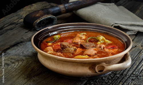 Traditional Hungarian goulash soup with stew and paprika. Prepared in a cauldron over a fire. Bograch.