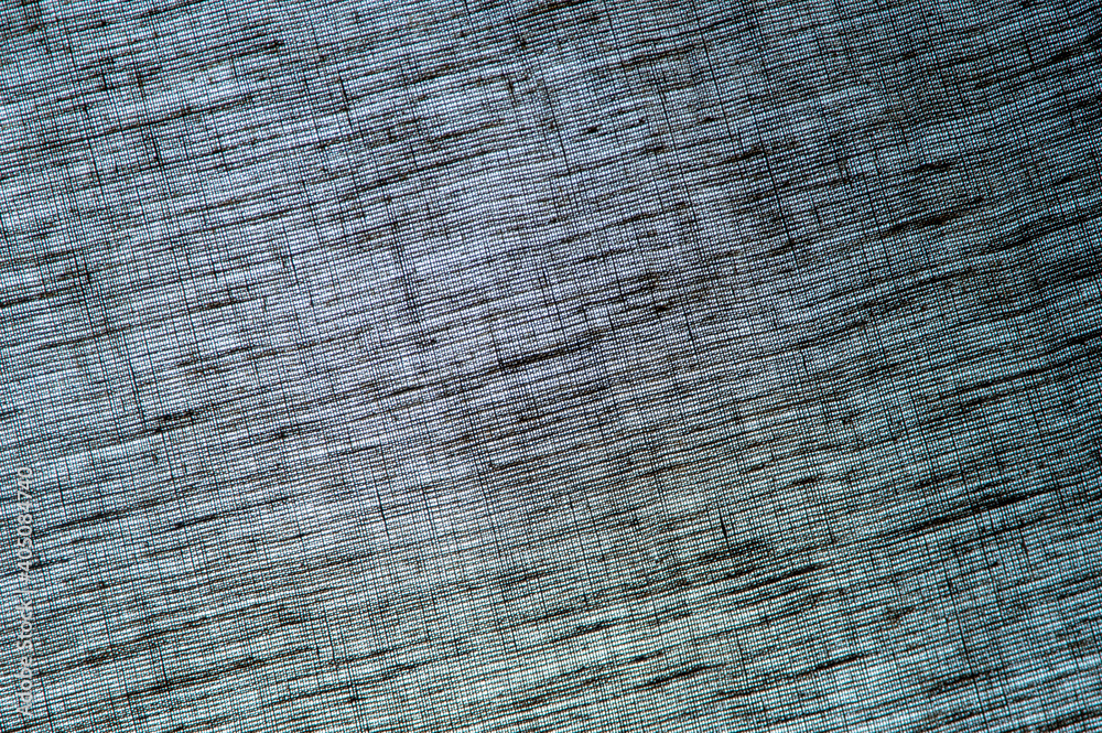 Fototapeta premium abstract rough colored linen natural fabric background, toning, short focus