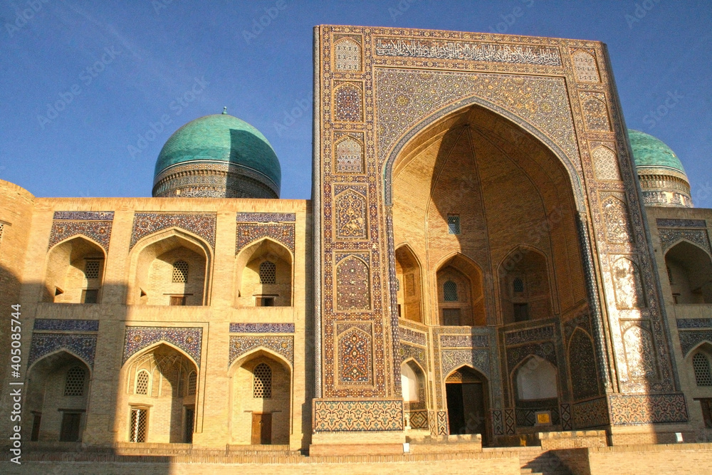 Bukhara, Uzbekistan - November 24 2019 : Poi Kalan or Po-i-Kalyan, an Islamic religious complex located around the Kalan minaret at cold weather