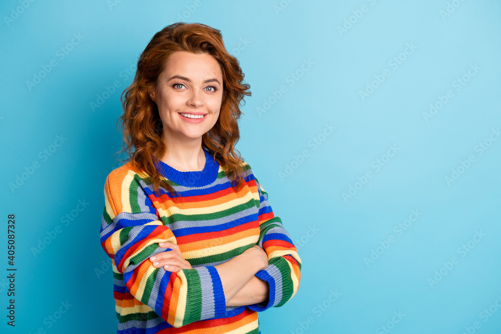 Fototapeta premium Photo of content charming lady crossed hands toothy smile wear sweater isolated on blue color background