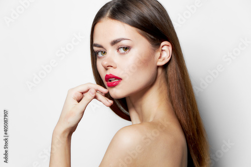 Attractive woman Charming look naked shoulders red lips 