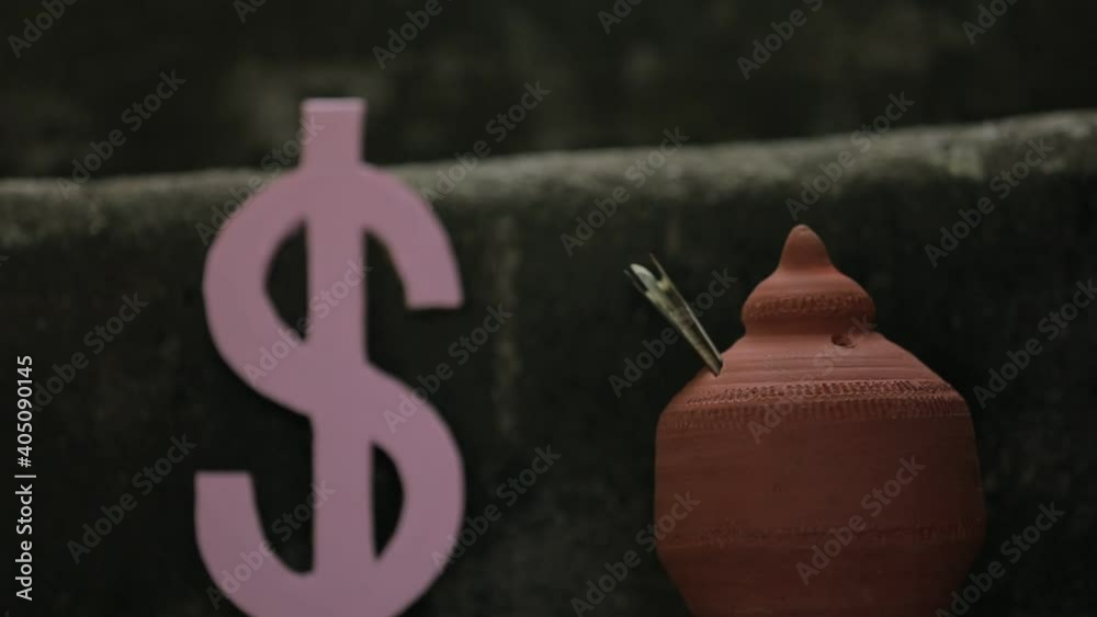 American Dollar symbol and clay piggy bank American Dollar symbol and clay piggy bank