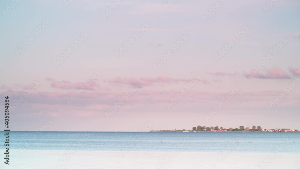 Seascape at evening. Baltic Sea, Puck Bay with Rewa village on horizin, Poland. Nature landscape. Seascape at evening. Baltic Sea, Puck Bay with Rewa village on horizin, Poland. Nature landscape.