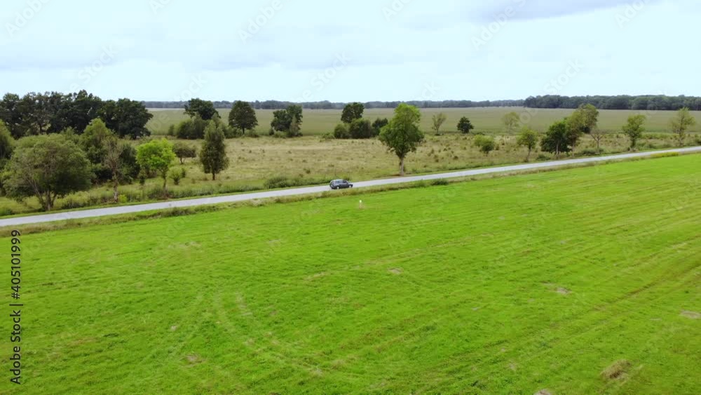 Aerial View Car Driving Road Agriculture Field in Summer Day. Road on Countryside Asphalt, Autumn Fields. Aerial View Road Trip Travel Journey Vacation Nature Countryside Rural Landscape. Aerial View Car Driving Road Agriculture Field in Summer Day. Road on Countryside Asphalt, Autumn Fields. Aerial View Road Trip Travel Journey Vacation Nature Countryside Rural Landscape.