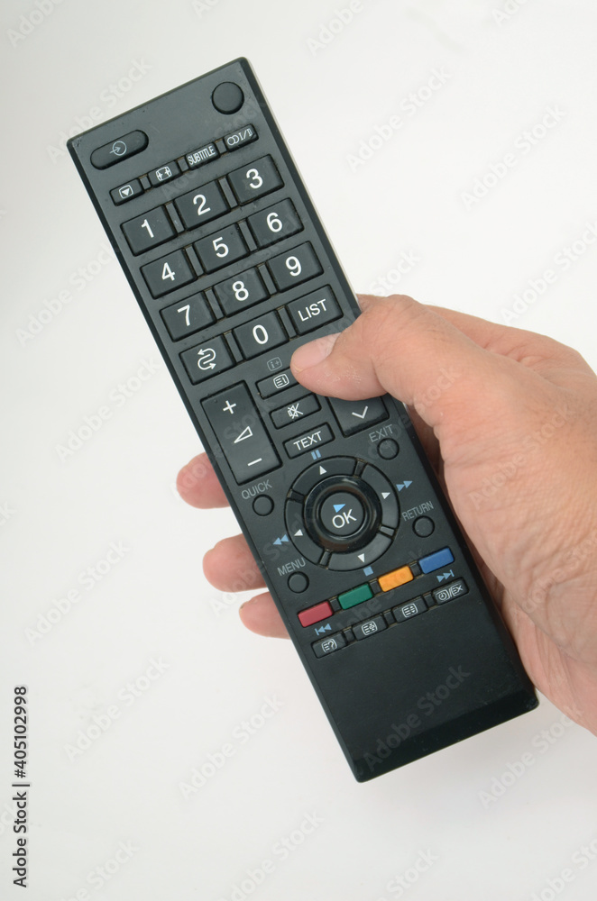 hand holding remote control isolated on white hand holding remote control isolated on white