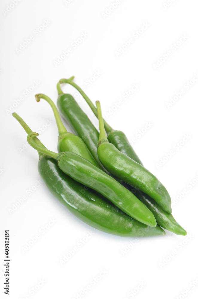 green chili peppers on white background green chili peppers on white background