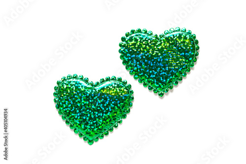 Saint Patrick and Saint Valentine day concept, green glitter hearts like irish shamrock clover