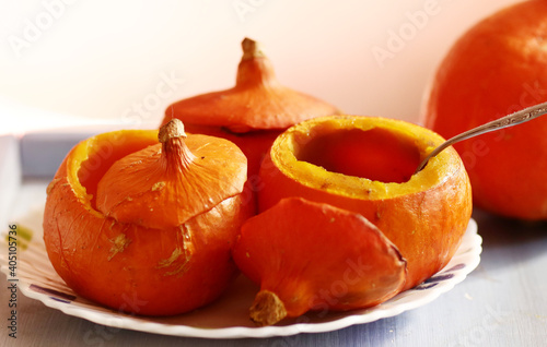 small pumpkin baked and raw still life halloween closeup photo photo