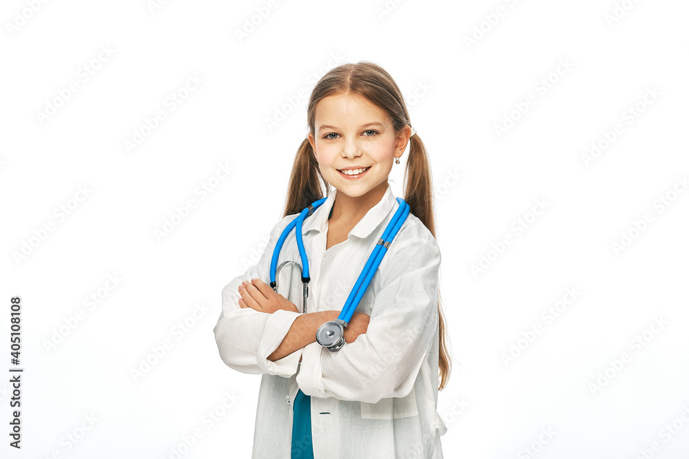 Positive girl wearing a medical coat and stethoscope, posing and looking at camera, isolated on white background Positive girl wearing a medical coat and stethoscope, posing and looking at camera, isolated on white background