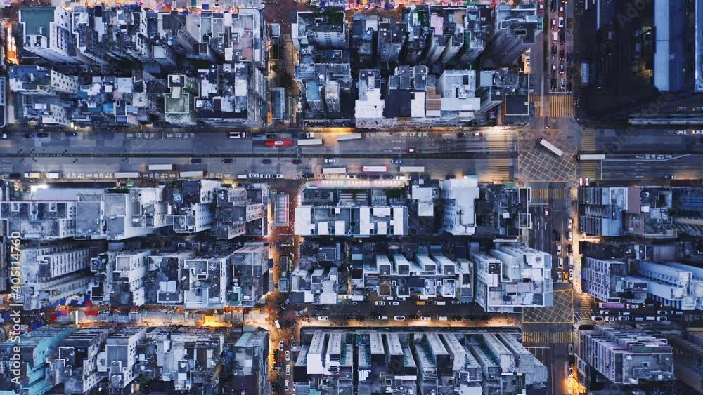 Aerial overhead view of city at night with buildings and streets in Kowloon, Hong Kong Aerial overhead view of city at night with buildings and streets in Kowloon, Hong Kong
