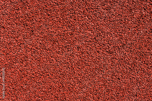 Red grain texture. Noise background. Grainy color tarmac design.