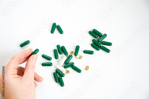 hand with pills, suplements food for health photo