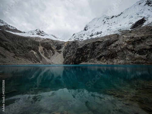 Panorama landscape view of andean alpine mountain lake Laguna 69 Cordillera Blanca Cebollapampa Huaraz Ancash Peru photo