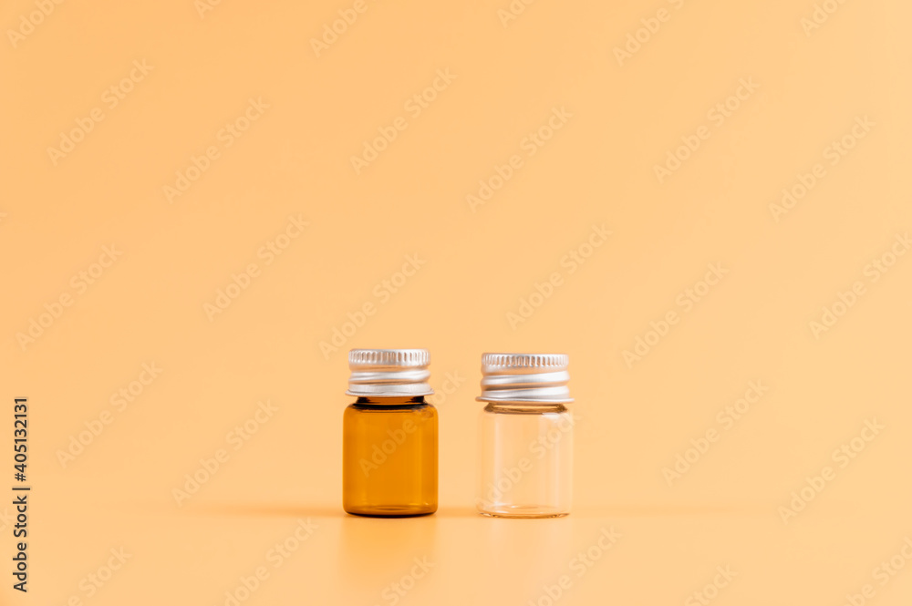 Medicine bottle placed, Blank label package for mockup on the orange background. The concept of natural beauty products.