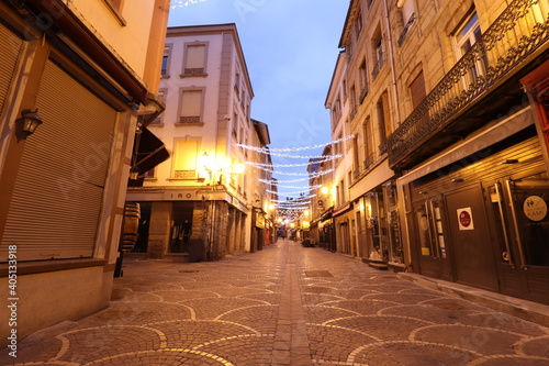 Fototapeta Naklejka Na Ścianę i Meble -  La rue des Martyrs de Vingré illuminée le soir, rue piétonne dans Saint Etienne, ville de Saint Etienne, département de la Loire, France