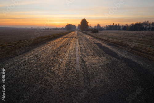 wide the road beyond the horizon at dawn