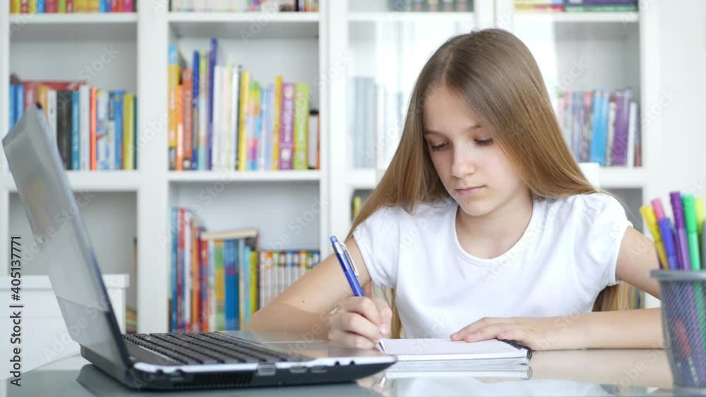 Kid Studying on Laptop in Coronavirus Pandemic, Child Learning, Writing at Home, Schoolgirl, Homeschooling, Online Education Kid Studying on Laptop in Coronavirus Pandemic, Child Learning, Writing at Home, Schoolgirl, Homeschooling, Online Education