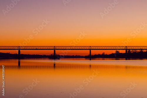 Bridge at sunset. Steel bridge over the Tagus river in Chamusca  Portugal