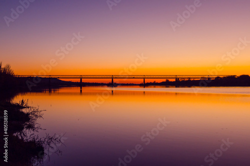 Bridge at sunset. Steel bridge over the Tagus river in Chamusca, Portugal