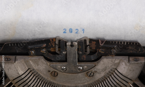 old typewriter with white sheet  lettering 2021