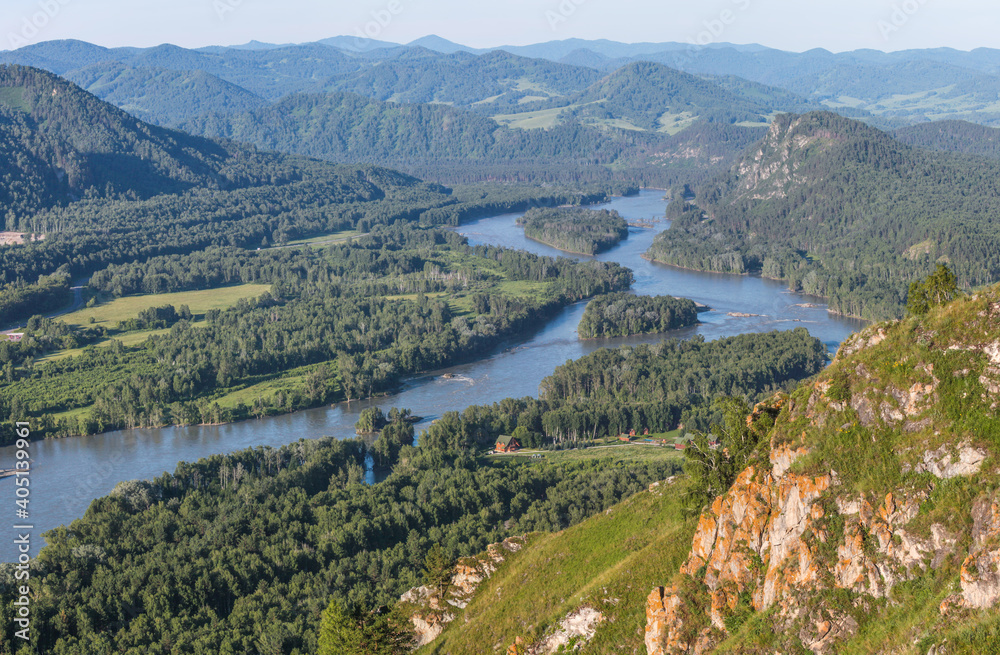 View of the Katun river valley, Altai. Sunny day in summer. Travel and vacation in the mountains. View of the Katun river valley, Altai. Sunny day in summer. Travel and vacation in the mountains.