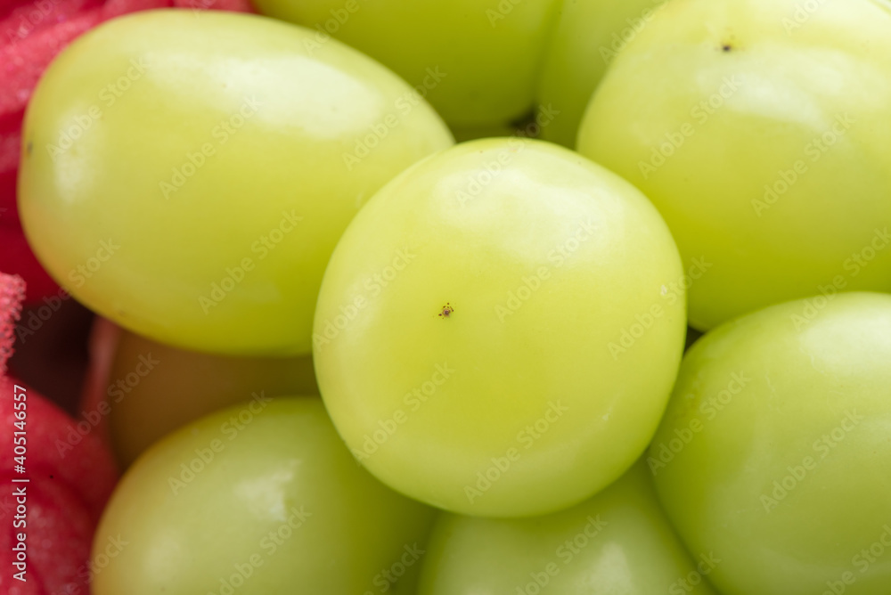 Beautiful boxed Shine Muscat green grape isolated on white background. Beautiful boxed Shine Muscat green grape isolated on white background.