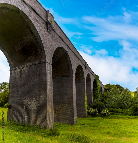 A close-up view along the side of the derelict and abandoned viaduct near Catesby, Northamptonshire, UK photo