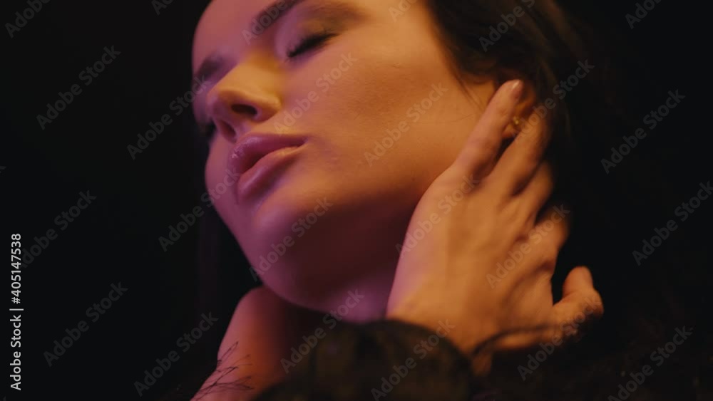 sexy woman with closed eyes touching face and neck isolated on black sexy woman with closed eyes touching face and neck isolated on black