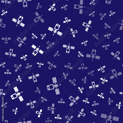 White Satellite icon isolated seamless pattern on blue background. Vector.