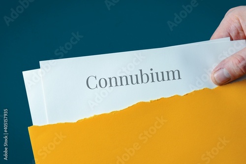 Connubium. Hand opens envelope and takes out documents. Post letter labeled with text photo