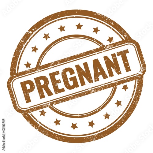 PREGNANT text on brown grungy vintage round stamp.