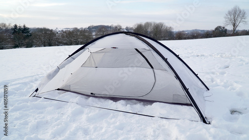 Camping in the snow during winter with a Trekkertent Tent near Fulda, Germany.
