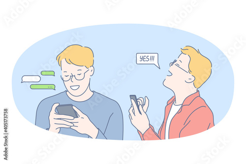 Smartphone, online communication, chatting concept. Young smiling man standing with smartphone in hands, chatting, searching information in internet, calling, dating or communicating online 