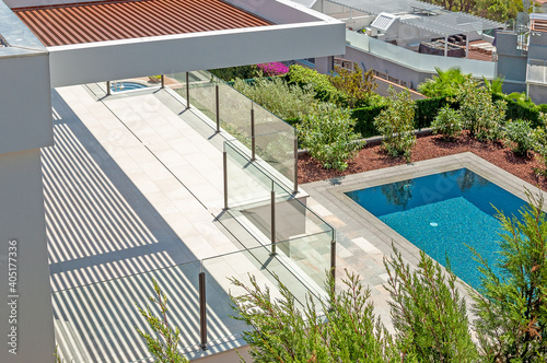 Sea view from a large terrace with a glass partition.