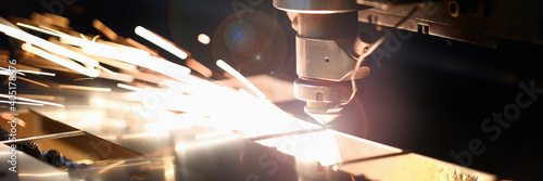 Close up of welding equipment in use during manufacturing of automobile parts on modern plant