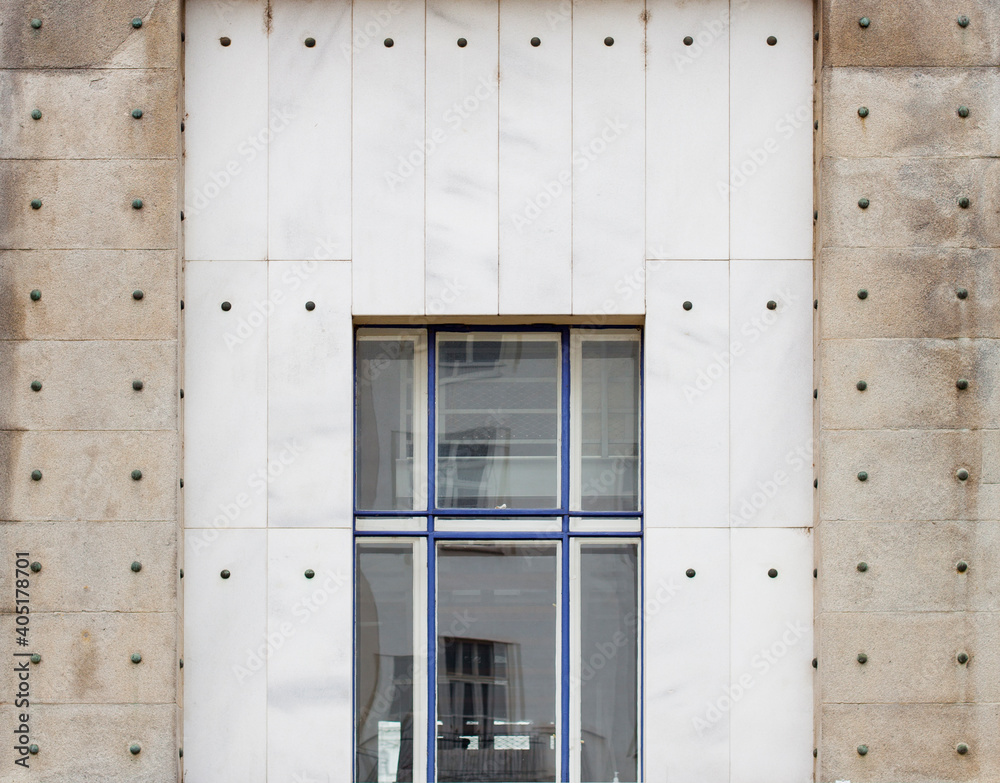 Fototapeta premium Facade with stone slabs and rivets. Fassade mit Steinplatten und Nieten.