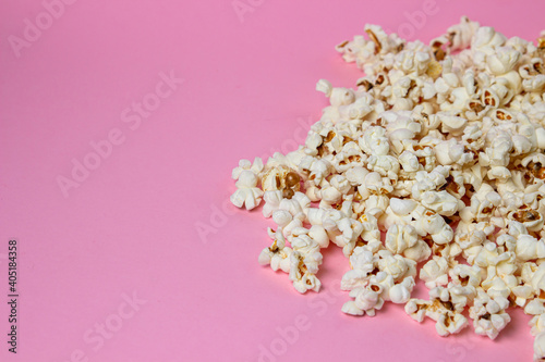 Popcorn on a pink background. There is a place for an inscription and a logo. Movie snack