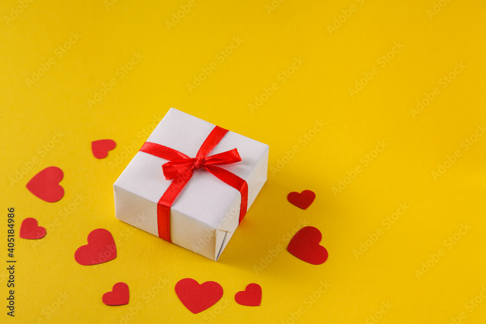 Valentine day gift boxes with and red hearts on yellow background. Gifts for loved ones. Top View. Copy space