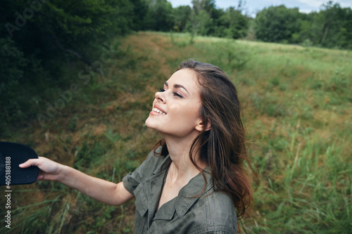 Woman portrait on nature Looks up a smile fresh air freedom 