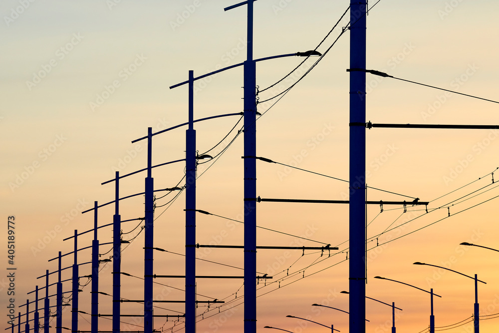 Lampposts on the background of the evening sky sunset Lampposts on the background of the evening sky sunset