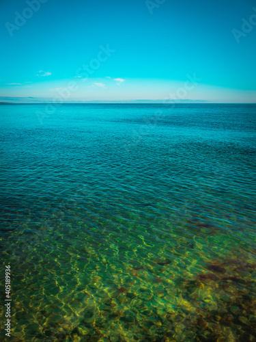 Tranquil seascape with a green sky and seawater © Naya Na
