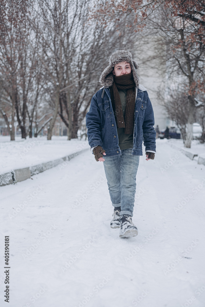 man walking in winter park