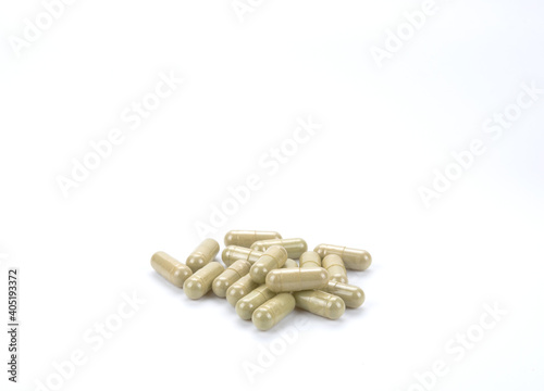 Herbal capsule on white background.