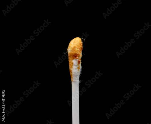 Used white cotton swabs on black background